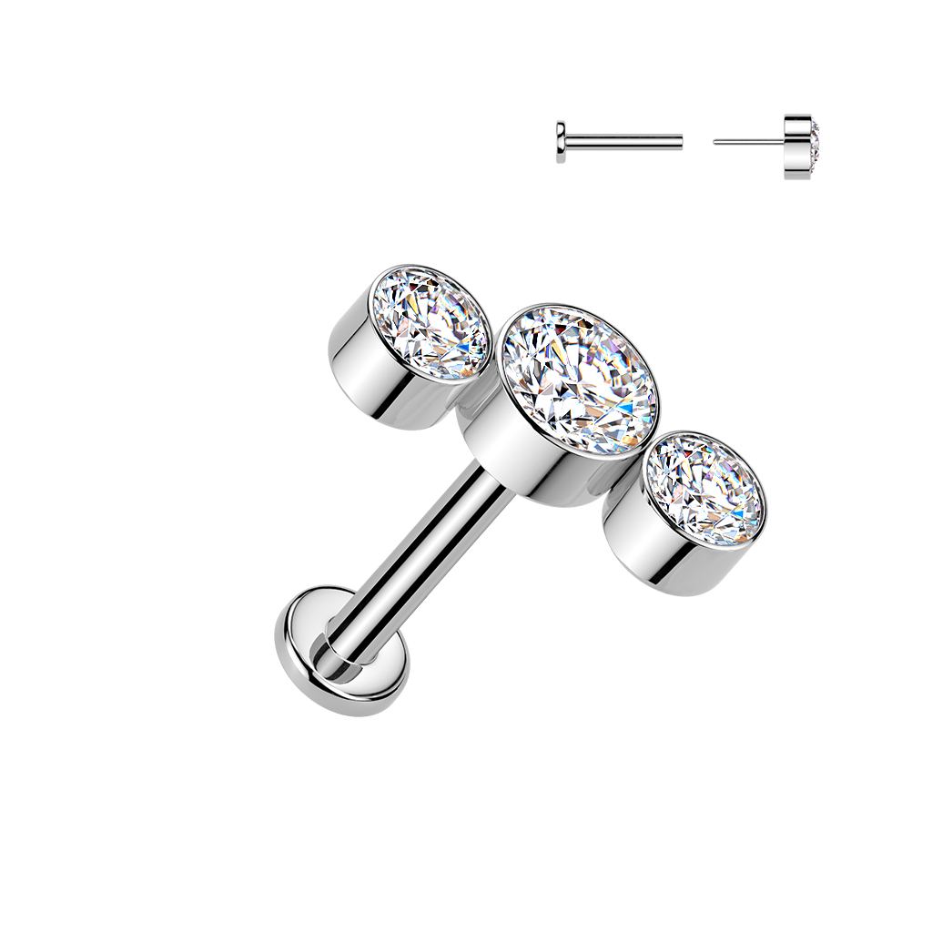 Silver titanium labret with three round bezel-set clear gemstones in a graduated row